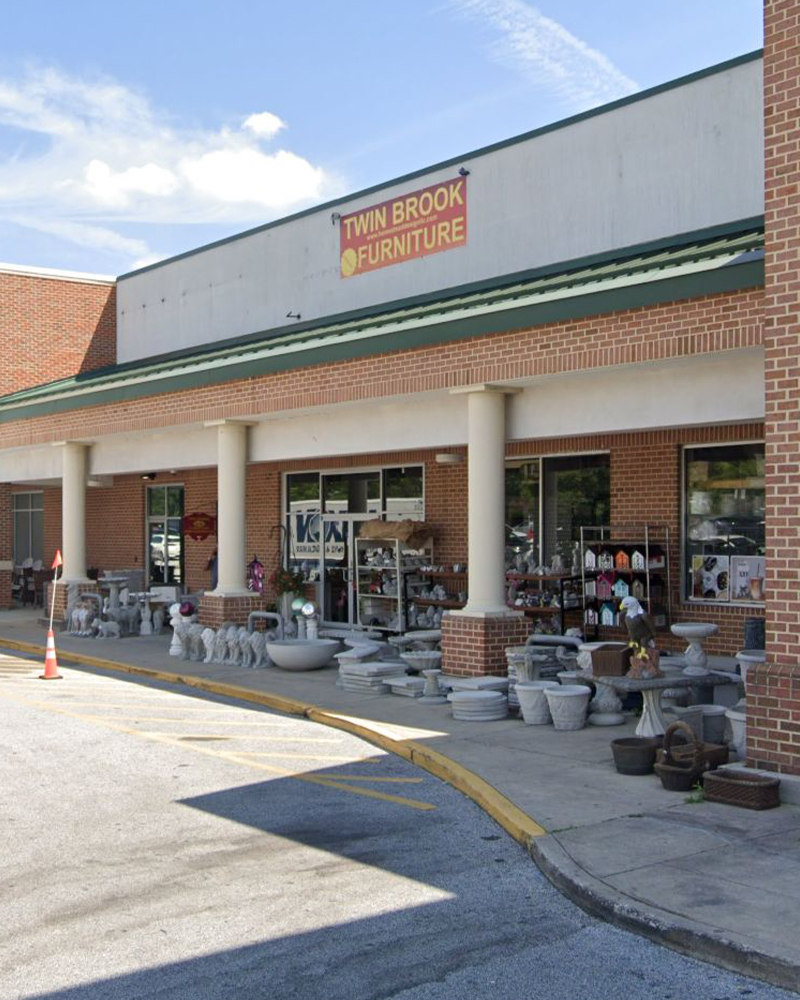 Twin Brook Furniture in Cockeysville, MD. storefront with concrete planters and birdhouses.
